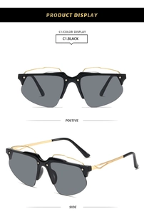 Vue détaillée des lunettes de soleil Y2K demi-cerclées avec fil ondulé doré et verres noirs