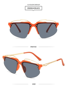 Vue détaillée de lunettes de soleil Y2K demi-cerclées orange et noir avec verres gris