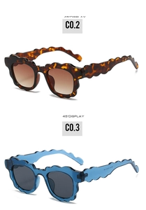 Detailed 45-degree view of scalloped wave frame sunglasses in tortoiseshell and blue