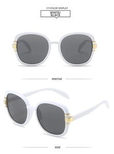 Detail view of white square sunglasses featuring gold metal accents and dark lenses