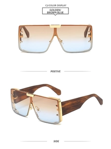 Detail view of gold metal square sunglasses featuring brown-blue gradient lenses