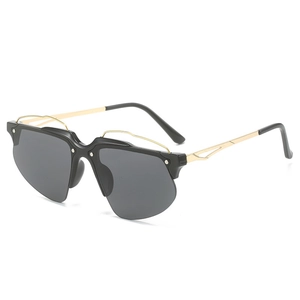 Lunettes de soleil Y2K demi-monture en métal doré avec verres noirs et détails géométriques