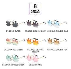 Flat lay of rimless leaf shaped sunglasses with colorful gradient lenses and gold frames