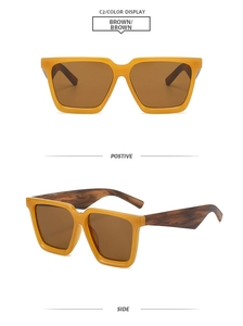 Detail of square orange sunglasses featuring stylish brown marble texture temples