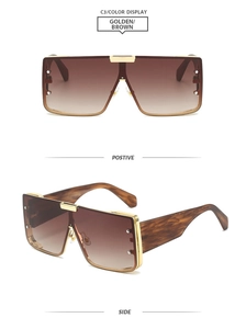 Detail view of square gold metal sunglasses with brown gradient lenses and leopard temples