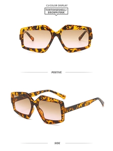 Macro view of geometric tortoiseshell sunglasses with brown pink gradient lenses