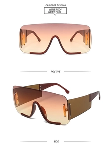 Détail de lunettes de soleil dégradées bordeaux surdimensionnées avec rivets argentés