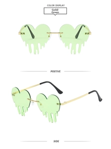 Détail de lunettes de soleil coeur sans monture avec verres verts et accents dorés fluides