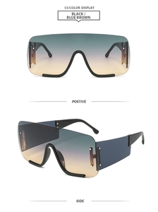 Détail de lunettes de soleil carrées oversize avec verres dégradés et rivets dorés