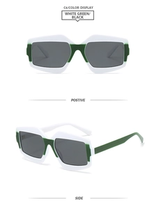 Detail view of bold geometric white and green contrast frame sunglasses with black lenses