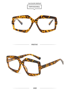 Detail of geometric tortoiseshell glasses frames with stylish brown and yellow patterns