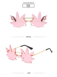 Frameless gold metal sunglasses with pink leaf shaped lenses shown from front and side views