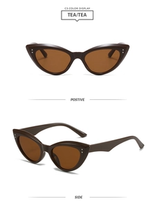Détail de lunettes de soleil œil de chat marron avec clous argentés sur la monture