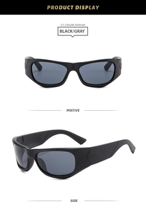 Close-up of sporty black frames with gray lenses and geometric embossed temple lines