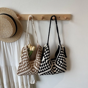 Handmade crochet shoulder tote bag with bohemian tassels for summer beach vacation