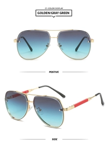 Detail of golden metal frame aviator sunglasses with blue-green gradient lenses