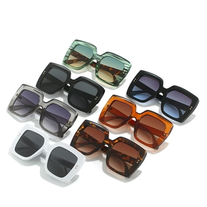 Collection of oversized square sunglasses featuring wood grain and luxury gold accents