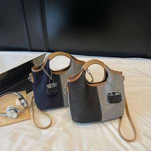 Chic two-tone canvas tote set with leather handles and mini charm for daily commute