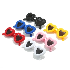 Detailed overhead view of heart-shaped Y2K sunglasses in six vibrant glossy colors