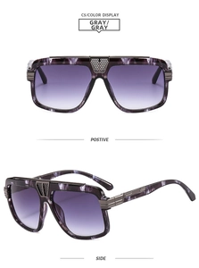 Detail view of oversized square sunglasses with purple gradient lenses and marble texture
