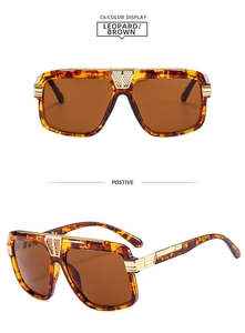 Detail of square leopard frame sunglasses with textured gold metal bridge and dark brown lenses