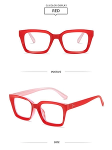 Macro view of red square glasses frames with silver rivets and polished finish