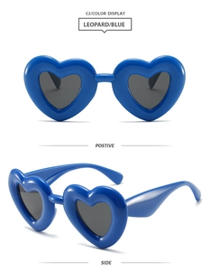 Front and side view of Y2K heart-shaped sunglasses with thick blue frames and grey lenses
