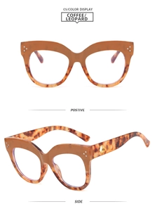 Cat eye glasses frame detail with brown leopard pattern and silver rivet accents