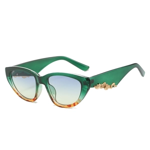 Vintage green cat-eye sunglasses with gradient lenses and gold embossed temples