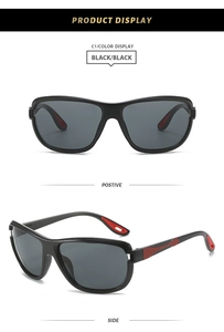 Vue détaillée de lunettes de soleil sport noires avec verres gris et embouts rouges