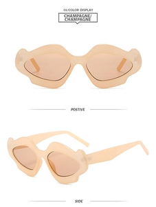 Detail view showing champagne Y2K lip-shaped sunglasses from front and side angles