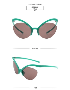 Détail des lunettes papillon demi-cerclées en vert transparent et verres thé