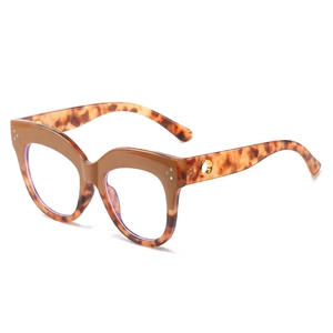 Fashionable oversized cat-eye glasses with brown and tortoise shell frame with silver studs