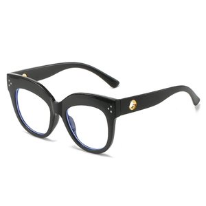 Fashionable oversized cat-eye glasses with black thick frames and gold metal accents