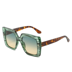 Square green striped sunglasses with tortoiseshell temples and blue gradient lenses