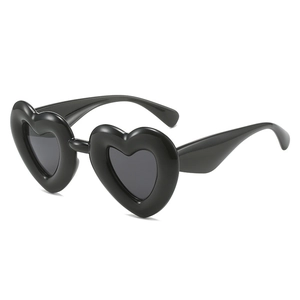Trendy Y2K black heart-shaped inflatable style sunglasses with dark UV lenses