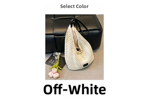 Detail of hand-woven cream tote bag with black leather strap on a stylish dark background