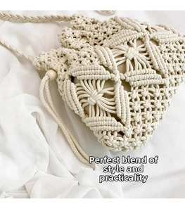 Detail of macramé cotton bucket bag showing intricate hollow weave and drawstring closure