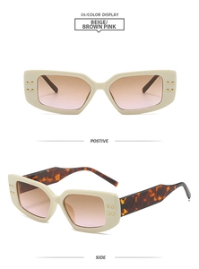 Detail of beige square sunglasses with brown pink gradient lenses and golden rivet accents