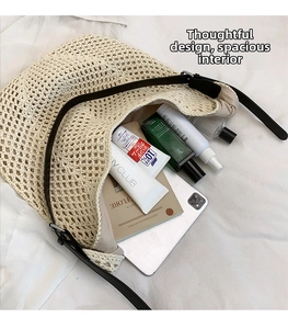Spacious interior of beige knit tote bag showing daily essentials and leather straps