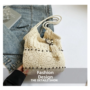 Detail of crochet cotton bag with wood beads and hollow mandala pattern weaving