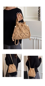 Detailed macro view of beige woven bucket bag with drawstring closure and wood beads