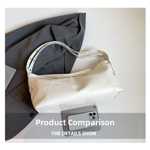 Detail of cream leather shoulder bag with metallic eyelets on the adjustable strap