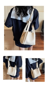 Litchi pattern leather bucket bag details with wide handles and adjustable strap