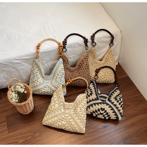 Various bohemian straw tote bags with wooden handles for a stylish summer beach vacation