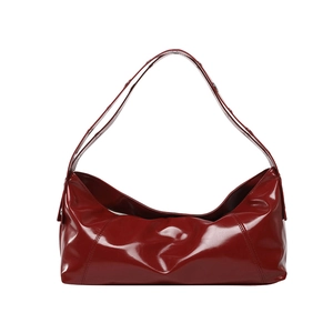 Minimalist deep red glossy patent leather handbag with slender handles for women