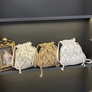 Boho retro crochet bucket bags in white and khaki colors with woven drawstring straps