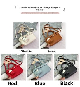 Close-up of leather crossbody bags in five colors with heart charms and adjustable straps