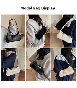 Mannequin portant le sac baguette chic en noir et blanc cassé à l'épaule pour femme
