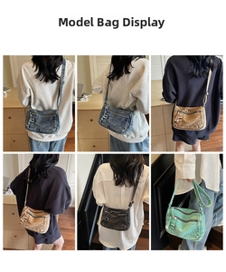 Detail of vintage washed denim crossbody bag showing multi-pocket design and adjustable strap
